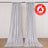 Flame retardant silver curtains hanging on a wall with floor-length drape