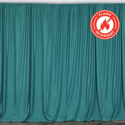 Flame retardant teal curtain draped elegantly in studio setting. #whtbkgd