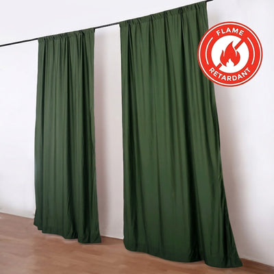 Green flame retardant curtains hanging on a rail in a room