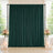Elegant dark green wedding backdrop with floral arrangements and candles