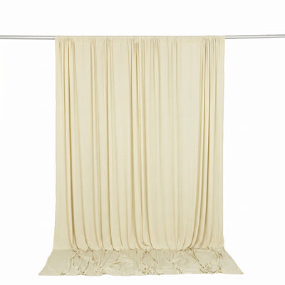 Cream draped curtain backdrop on silver rod, studio photography background