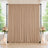 Elegant beige wedding backdrop with floral arrangements and candles