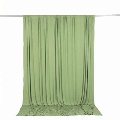 Light green draped fabric backdrop hanging on a curtain rod