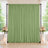 Green wedding backdrop curtain with floral arrangements and candles