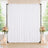 Elegant white wedding backdrop with floral arrangements and candles