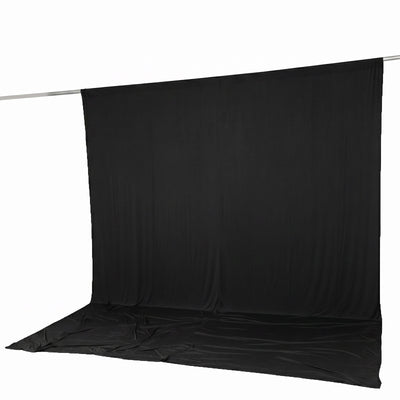 Black photography backdrop with seamless floor on support stand