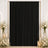 Elegant black curtain backdrop with white roses and candles for event decor