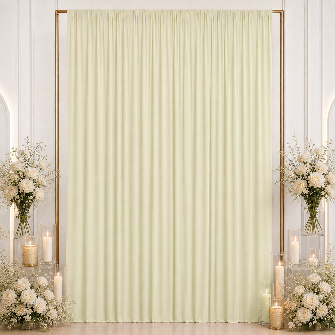 Elegant cream curtain backdrop with floral arrangements and candles