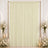Elegant cream curtain backdrop with floral arrangements and candles