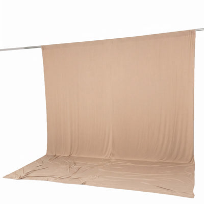 Beige seamless fabric backdrop on stand for photography studio