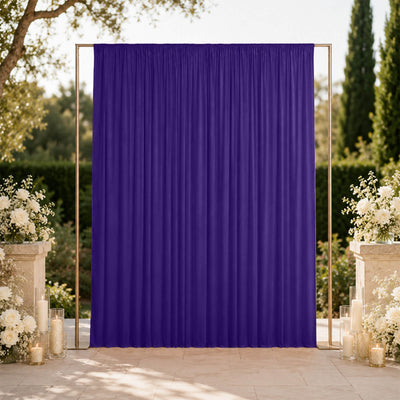 Purple wedding backdrop with floral arrangements and gold frame outdoors