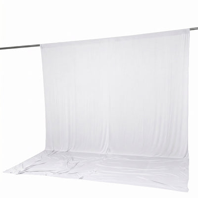 White photography backdrop with seamless floor drape on support rod