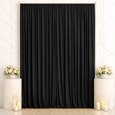 Elegant black curtain backdrop with gold frame and floral wedding decor