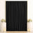 Elegant black curtain backdrop with gold frame and floral wedding decor