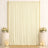 Elegant cream wedding backdrop with gold frame, floral arrangements, and candles