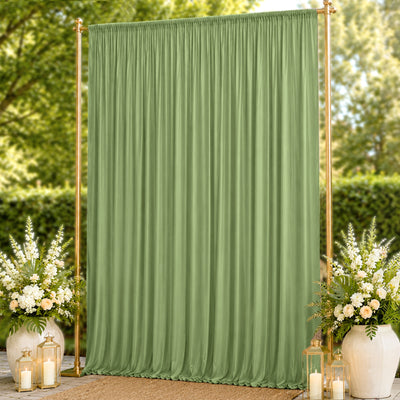Elegant sage green curtain backdrop with gold stand and floral arrangements outdoors