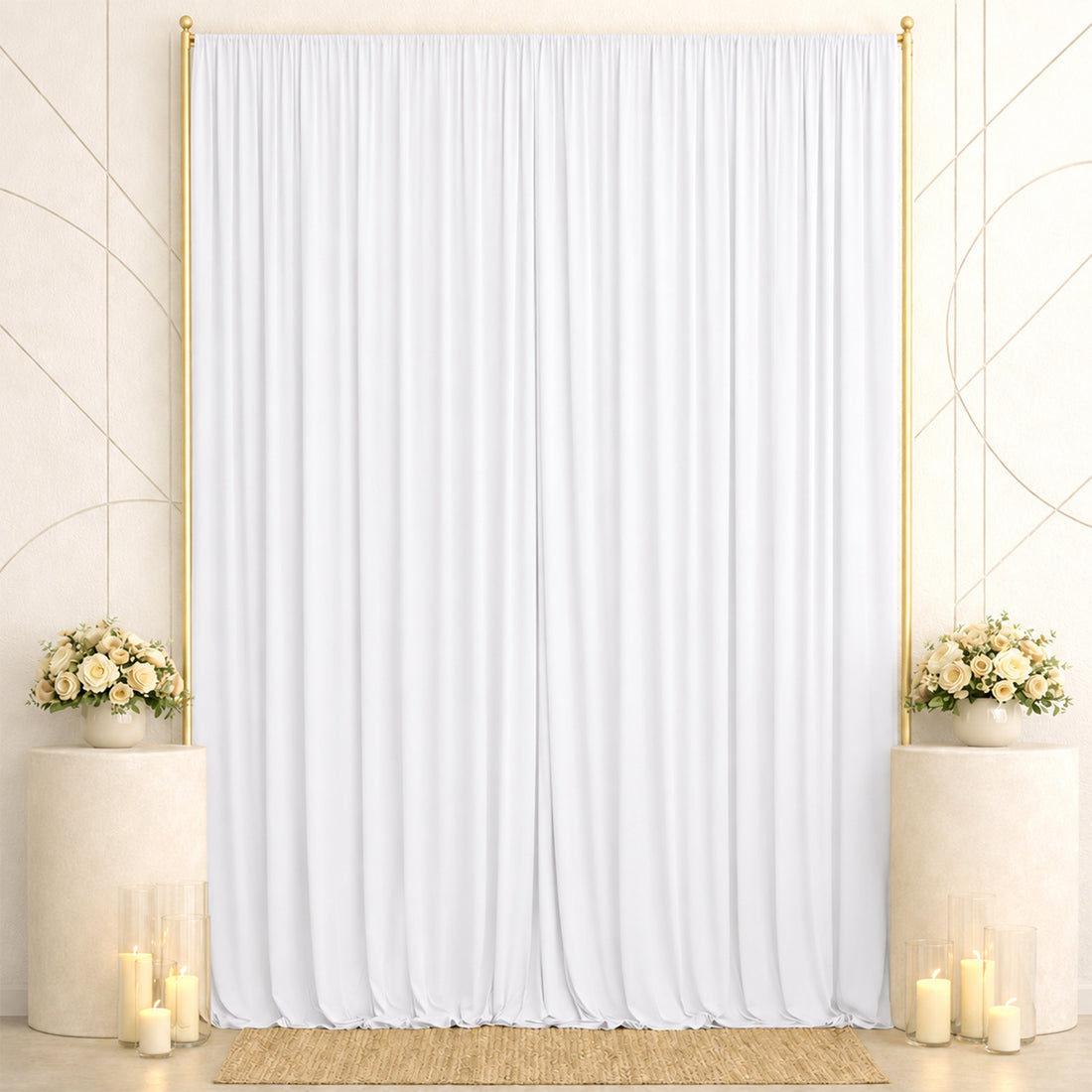 Elegant white wedding backdrop with gold accents, floral arrangements, and candles