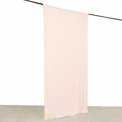 Minimal blush sheer curtain hanging on a black rod against a white background