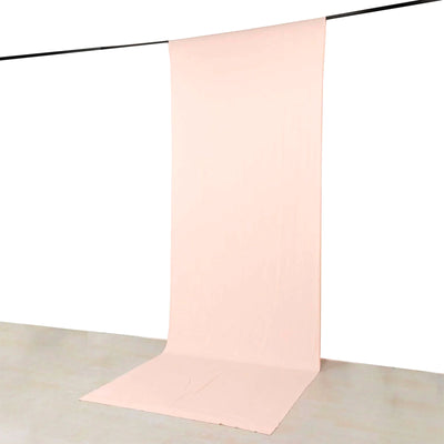 Pink seamless backdrop hanging on a rod for photography studio background