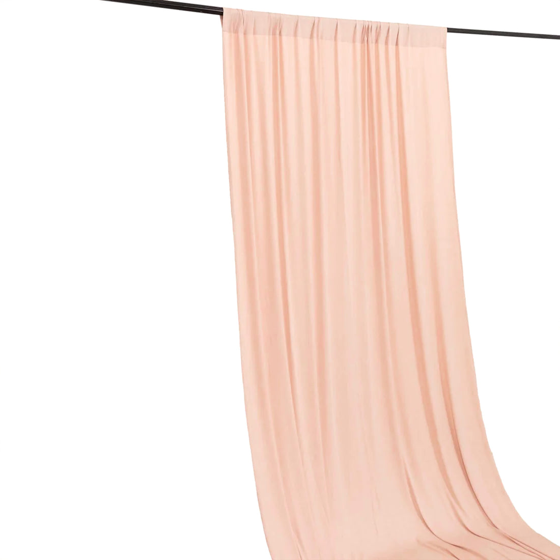 Blush pink sheer curtain panel hanging on rod