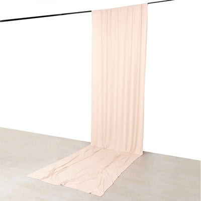 Beige sheer curtain backdrop with floor drape on studio hanging rod