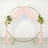 Pink draped floral wedding arch with gold circular frame and white yellow flowers