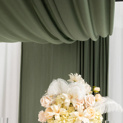 Elegant floral arrangement with soft pastel blooms and feathery accents.