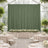 Elegant green backdrop in a decorated event space with floral arrangements.