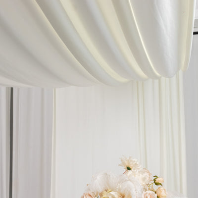 Elegant floral arrangement with soft pastel colors against a light backdrop.