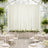 Elegant wedding reception with floral decor in a bright, airy greenhouse setting.