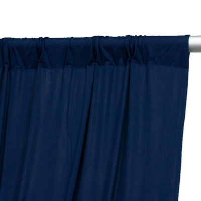 Navy blue curtain with gathered top, perfect for adding elegance to any room.