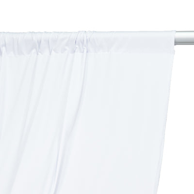 White curtain panel draped over a curtain rod