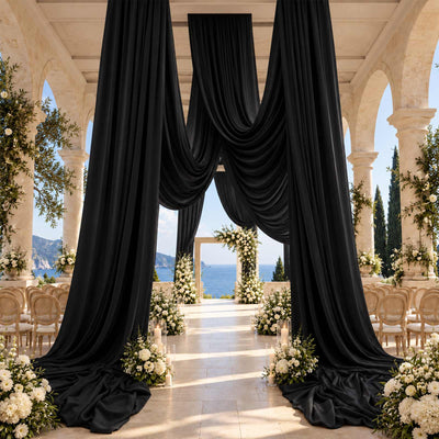 Luxury seaside wedding venue with black drapery and floral aisle, sea view