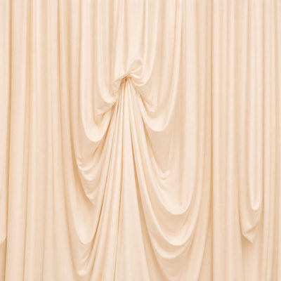 Cream draped fabric backdrop with elegant soft folds