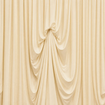 Elegant ivory draped curtain backdrop with soft gathered folds