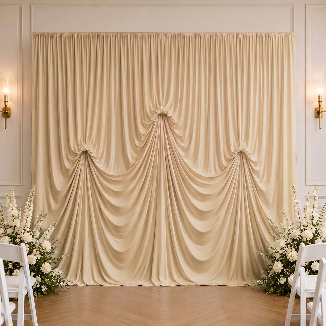 Elegant wedding draped backdrop with white flowers and chairs