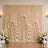 Elegant wedding draped backdrop with white flowers and chairs