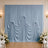 Elegant blue wedding drapery backdrop with white floral arrangements