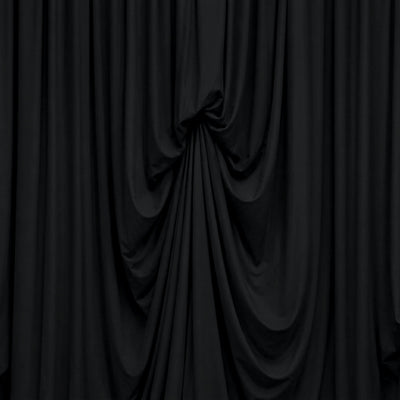 Black draped curtains with elegant pleated fabric backdrop