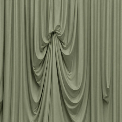 Elegant draped sage green curtains with soft folds and gathered center knot