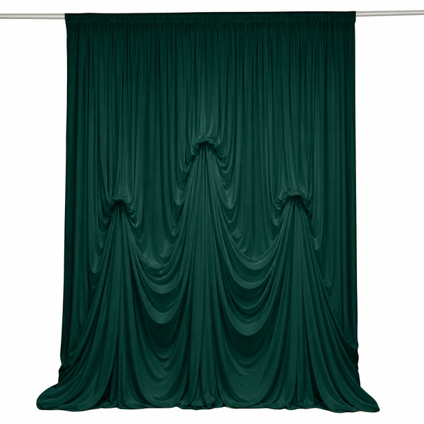 Dark green velvet draped curtain backdrop on white background