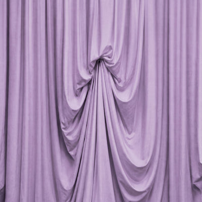 Lavender draped fabric curtain with elegant folds and soft texture