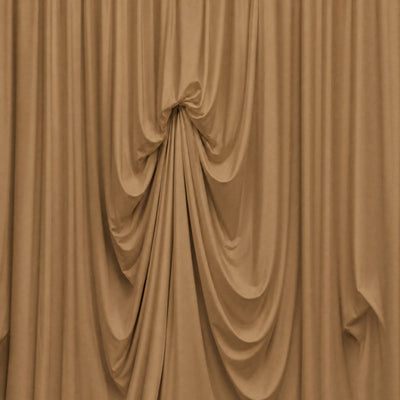 Beige draped fabric backdrop with elegant gathered folds