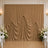 Elegant gold wedding backdrop with draped curtains and white floral arrangements