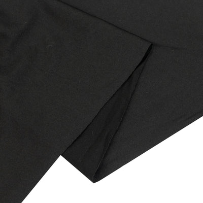 Black cotton fabric folded on a white background