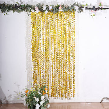Add a Touch of Glamour with the Metallic Gold Wavy Tinsel Streamer Party Backdrop