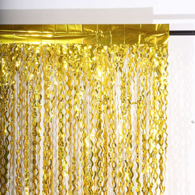 Gold foil fringe curtain for parties and celebrations