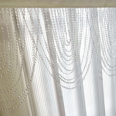 Crystal beaded curtain drapes for elegant home decor.