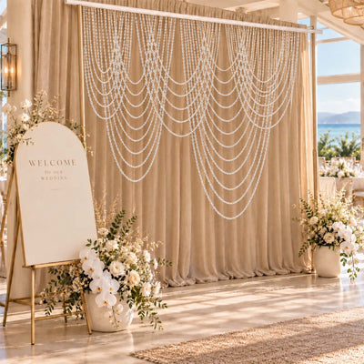 Elegant wedding stage with burgundy velvet backdrop and floral candle decor