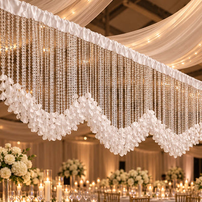 Elegant wedding reception decor with crystal bead chandeliers and floral draping